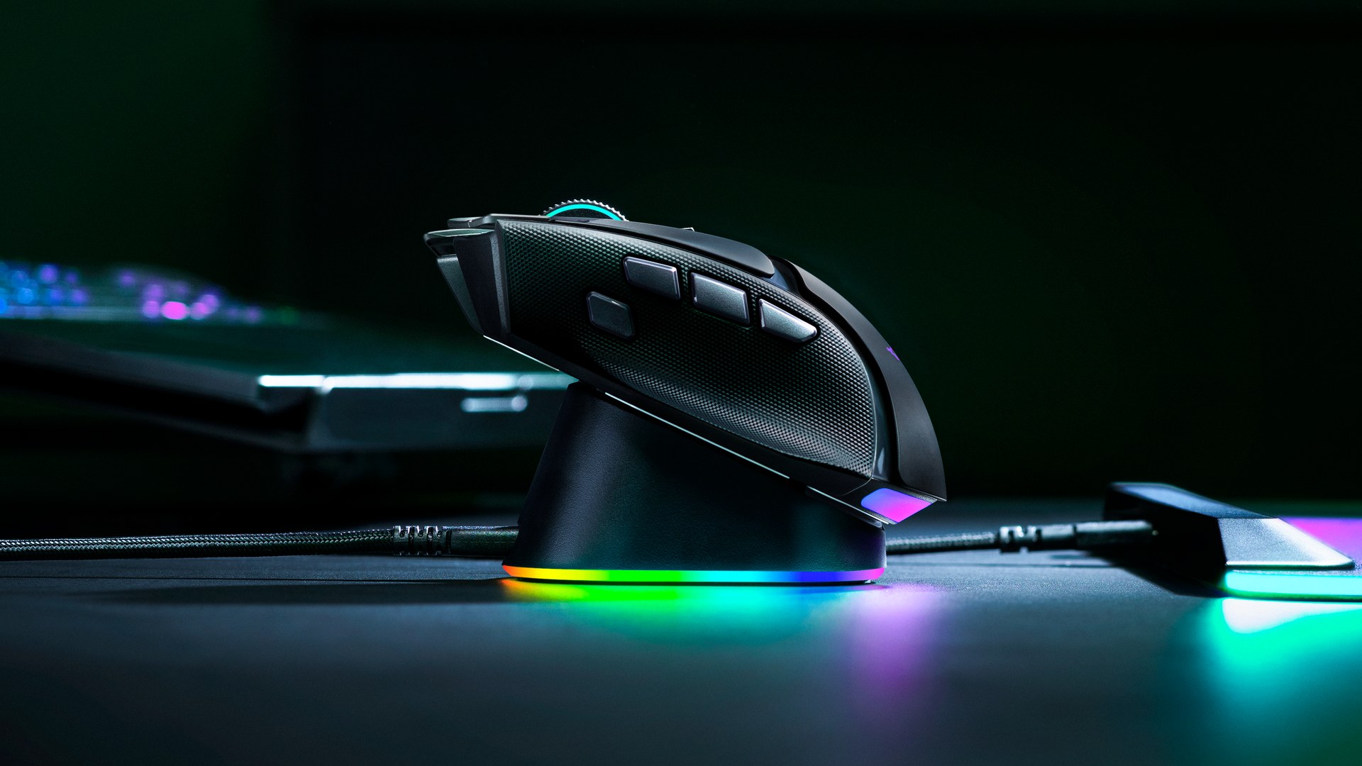 Razer Basilisk V4 Pro seated on the Mouse Dock V2 Pro with colorful Chroma underglow around its base