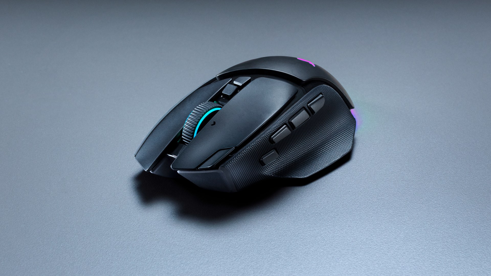 Razer Basilisk V4 Pro seen from the front, showing the tilt scroll wheel with a cyan ring and the three side buttons
