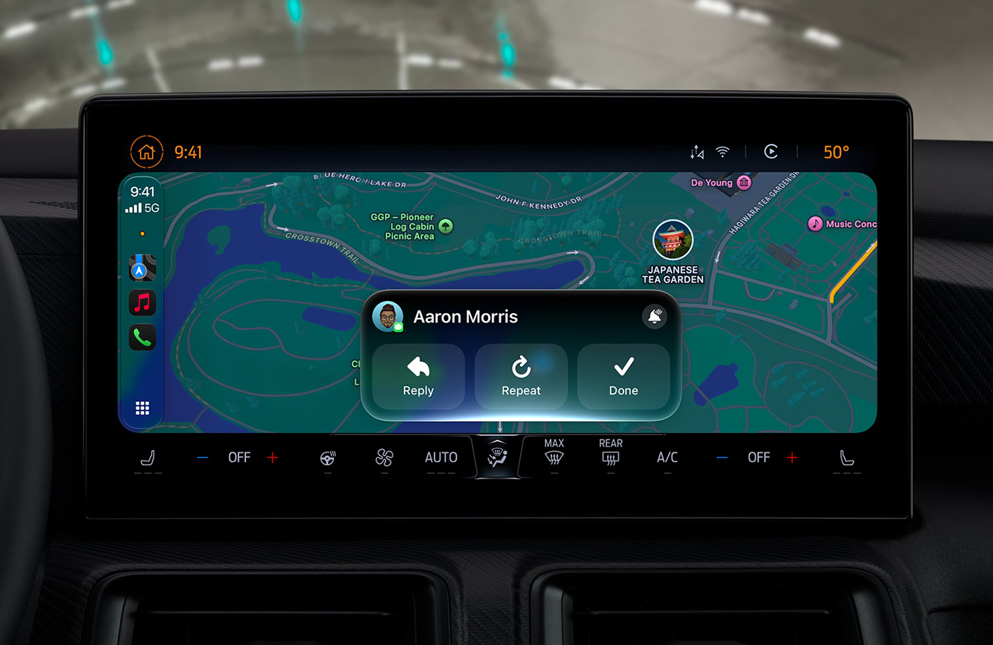 Wide car dashboard screen showing a green park map at 9:41 with 50 degrees, a phone-style sidebar, and a message card for Aaron Morris with Reply, Repeat, and Done buttons