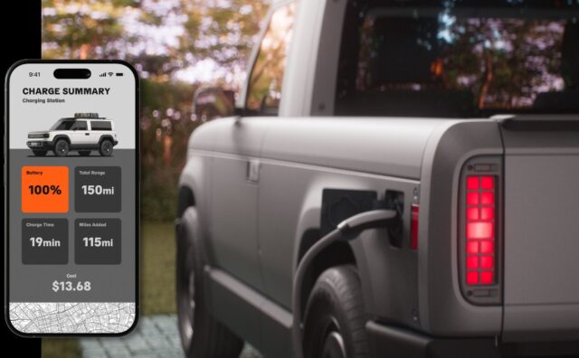 tmm-slate-truck-charge-summary-app Official Slate charging still: a phone Charge Summary screen showing 100 percent battery, 150 mi total range, 19 min charge time, 115 mi added, and $13.68 cost, beside a gray pickup with a plug in the rear charge port and a lit red tail lamp
