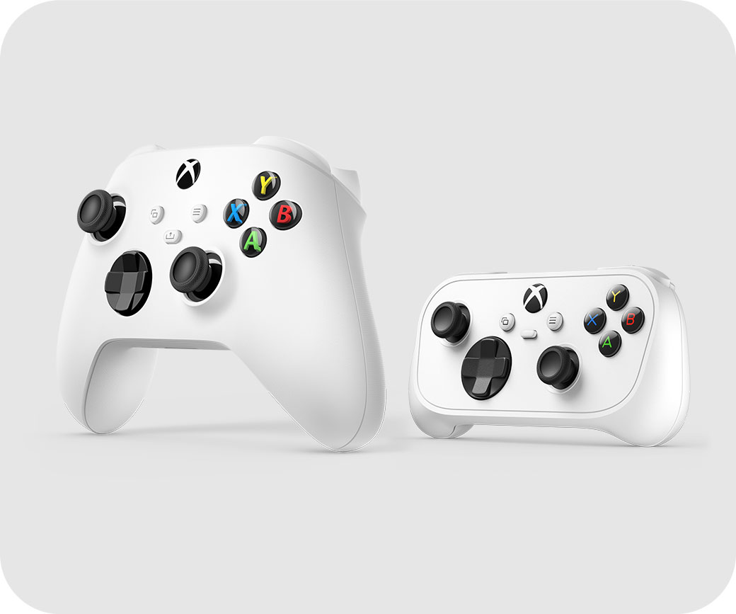 A white Xbox Wireless Controller beside a smaller white Xbox Nano Controller