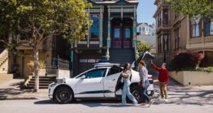 California Robotaxi Law Sets $10,000 Fines for Blocking First Responders, Starting in 2028 White Waymo Jaguar I-PACE robotaxi parked on a San Francisco street with riders loading the trunk