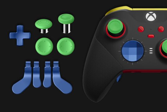 Current Xbox Elite Series 2 controller in black beside swappable green thumbsticks, a blue D-pad and blue paddles. Not the leaked controller.